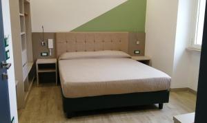 Postel nebo postele na pokoji v ubytování HOTEL HOUSE GARGANO