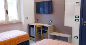 TV a/nebo společenská místnost v ubytování HOTEL HOUSE GARGANO