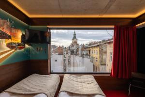 Postel nebo postele na pokoji v ubytování !FEST Hotel Rynok Square