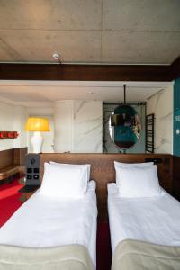 Postel nebo postele na pokoji v ubytování !FEST Hotel Rynok Square