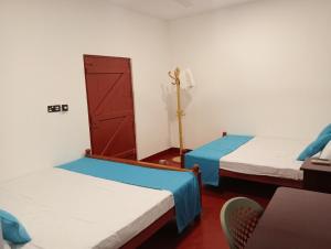 Una cama o camas en una habitación de Cha Cha Guest House