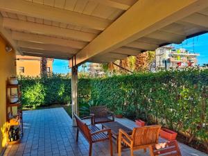 a patio with two chairs and a table at Da Vinci Apartment in Tortoreto Lido