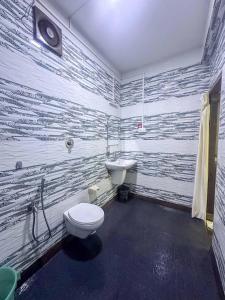 a bathroom with a toilet and a sink at Secret Garden Agonda Beach Resort in Agonda +69 photos