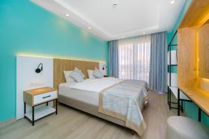A bed or beds in a room at Villa Sunflower Hotel - All Inclusive