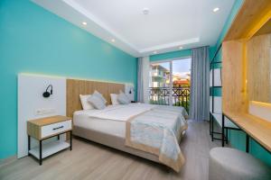 A bed or beds in a room at Villa Sunflower Hotel - All Inclusive