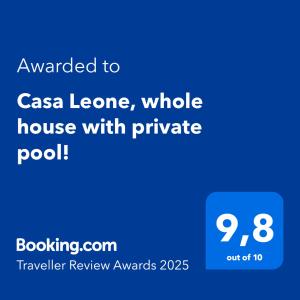 a screenshot of a cell phone with the text awarded to casa leona at Casa Leone, whole house with private pool! in Atsipopoulo