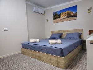Ένα ή περισσότερα κρεβάτια σε δωμάτιο στο HAVAS Guest House