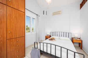 Ένα ή περισσότερα κρεβάτια σε δωμάτιο στο Villa Dimitris +37 φωτογραφίες
