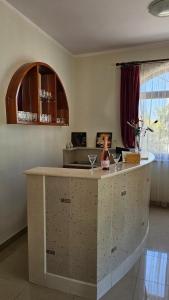 a kitchen with a counter with wine glasses on it at New Villa Dubai - Okrug Gornji,Trogir, Hrvatska in Trogir +41 photos