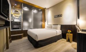 Postel nebo postele na pokoji v ubytování 凝萃 水岸隱邸-NCH G11 Hotel + 39 fotografií