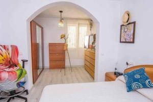 Łóżko lub łóżka w pokoju w obiekcie Dúplex El paseo Marítimo