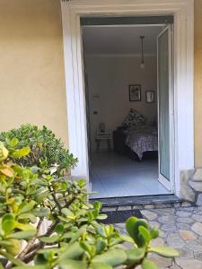 a door leading into a bedroom with a bed at Residence Rodi in Alassio