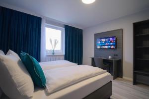 Postel nebo postele na pokoji v ubytování Hotel Kiel by MELIO
