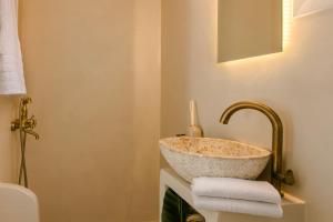 a bathroom with a sink and a toilet at Casa Loggia in Lixouri