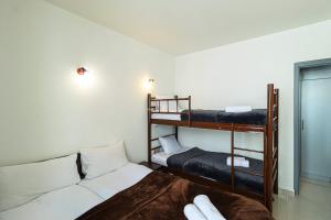 a bedroom with two bunk beds and a bed at 1BR Apartment in Gudauri in Gudauri