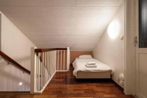En eller flere senger på et rom på ARCTIC HOMES - Villa Borealis