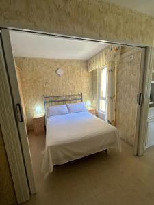 Ένα ή περισσότερα κρεβάτια σε δωμάτιο στο Apartamento BuenasVistas