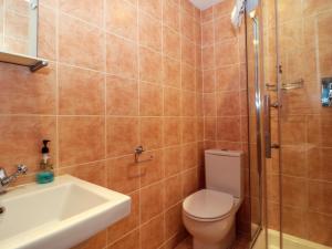 a bathroom with a toilet and a sink and a shower at Suite 3 in Stroud +6 photos