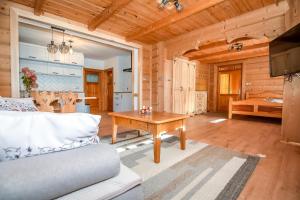 a living room with a couch and a table at U Pabinów in Kościelisko