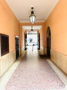 an empty hallway with a light hanging from the ceiling at Western Termini Guest House in Rome