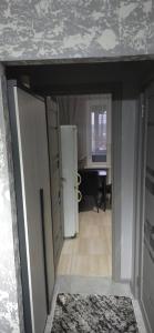 a room with a door and a room with a desk at Apartament in Bălţi +6 photos