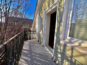 a balcony of a house with a window at Just Home in Varna City