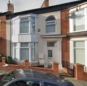 a house with a car parked in front of it at Levy Nook House 1 bed apartment 5 minute walk to Stockton town centre & Free Parking in Stockton-on-Tees