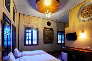 Säng eller sängar i ett rum på Hotel des Oudaias