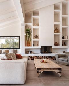 a living room with a couch and a coffee table at Villa Jade in Jávea