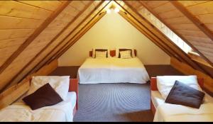 Postel nebo postele na pokoji v ubytování Resort Stara Škola + 37 fotografií