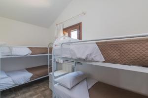 A bed or beds in a room at Villetta - Aliterno V5