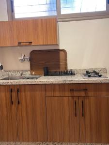 a kitchen with a sink and a counter top at Dyafat Abla in Ouarzazate