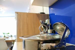 a pot sitting on top of a stove in a kitchen at Schönhier - Design Apartment mit Pool, Sauna in Schluchsee