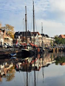 a group of boats are docked in a harbor at Klipper Engelburg in Zwolle +18 photos