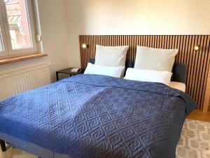 Letto o letti in una camera di Gemütliche Wohnung in unmittelbarer Nähe zum See