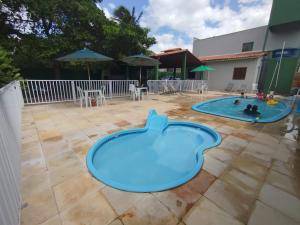 a swimming pool in a backyard with two pools at Marcone Lima anexo in Barreirinhas
