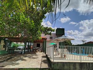 a resort with a swimming pool and a house at Marcone Lima anexo in Barreirinhas