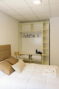 Postel nebo postele na pokoji v ubytování Don Pedro Apart Hotel