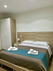 Letto o letti in una camera di Tempio Aurora