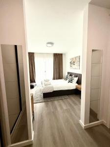 Postel nebo postele na pokoji v ubytování RULU Studio Plaza Mall