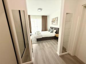 Postel nebo postele na pokoji v ubytování RULU Studio Plaza Mall