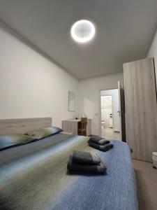A bed or beds in a room at *Veranda's rooms* - Free parking in central Lugano