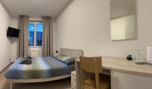 TV a/nebo společenská místnost v ubytování *Veranda's rooms* - Free parking in central Lugano