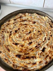 a pie in a pan on a table at Kuća za odmor Ravančić in Sopot +12 photos