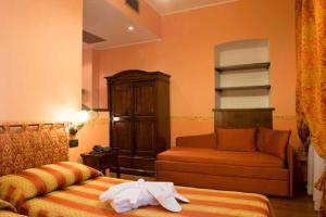 Postel nebo postele na pokoji v ubytování Hotel Belle Epoque
