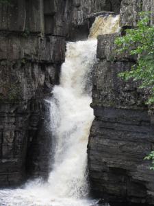 a waterfall on the side of a rock wall at 7 Front Street in Saint Johns Chapel +12 photos