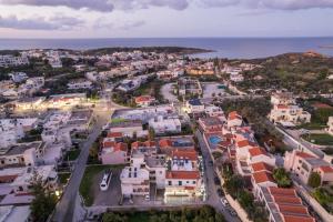 an aerial view of a city with houses at Vasilikis Apartments in Daratso +15 photos