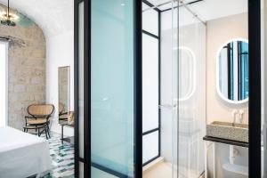 a bathroom with a glass shower and a sink at Miramare Sea Resort & Spa in Ischia