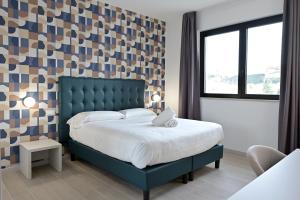 Postel nebo postele na pokoji v ubytování Hotel HE ROMA + 21 fotografií