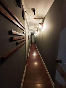 a hallway with a long corridor with lights on the wall at Donde PATO in Iquique